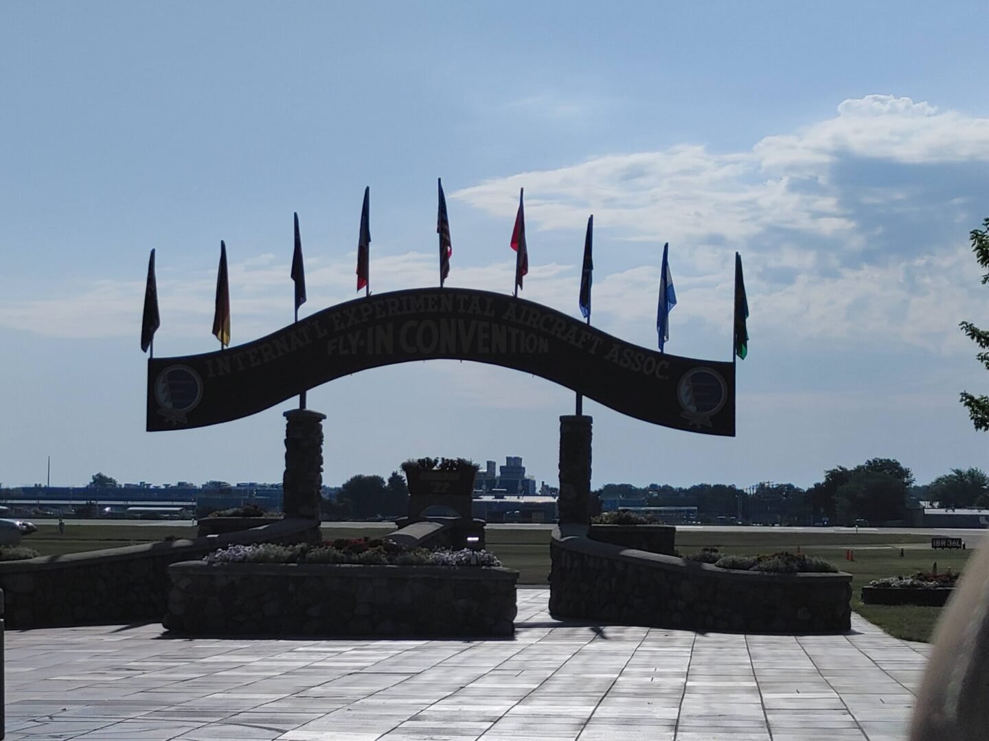 A large arch with flags on it