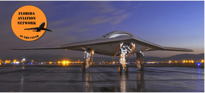 A stealth aircraft on a runway at dusk.